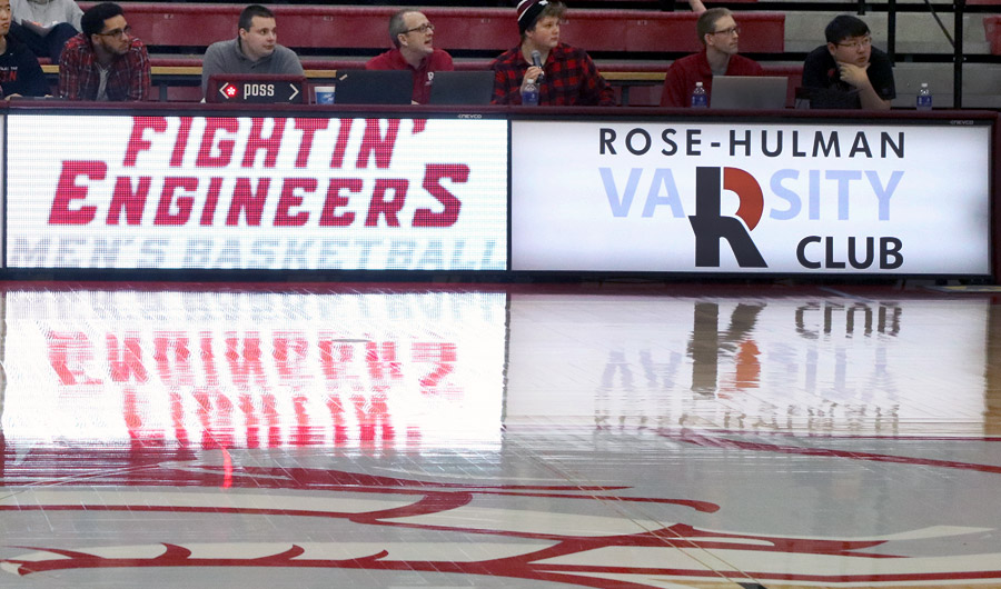 Image shows new scorer's table at basketball court  with Varsity R Club logo.